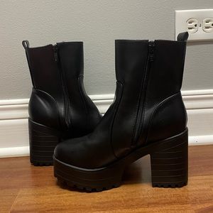 Black platform boots.